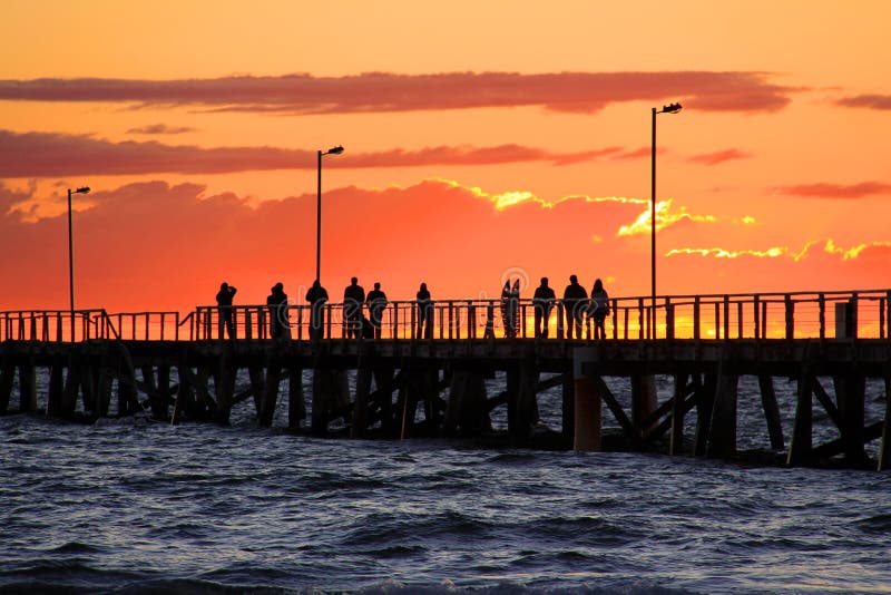 People on Jetty watching Sunset