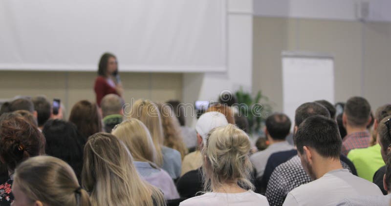 People listen as the speaker tells the speech at a seminar