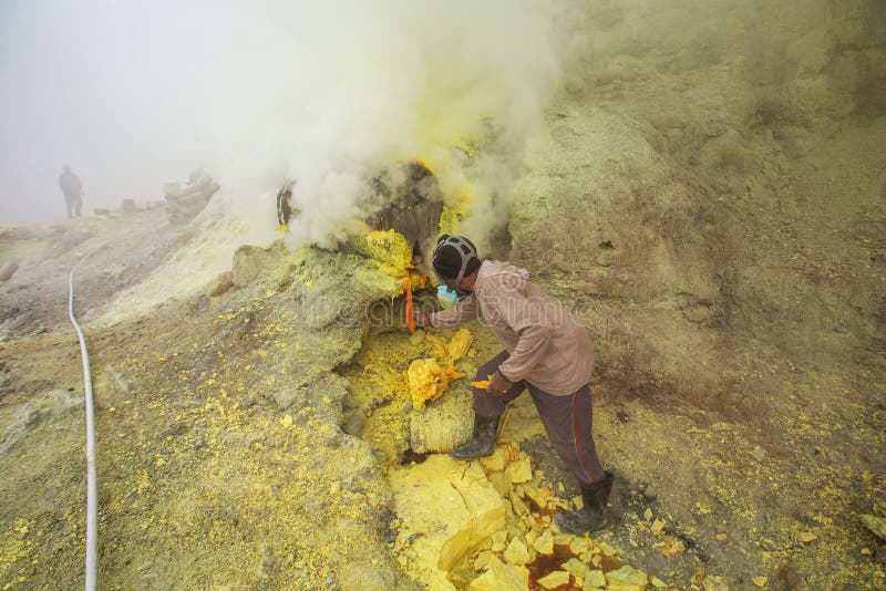 People mining sulphur in Ijen volcano, Java , Indonesia royalty free stock photos