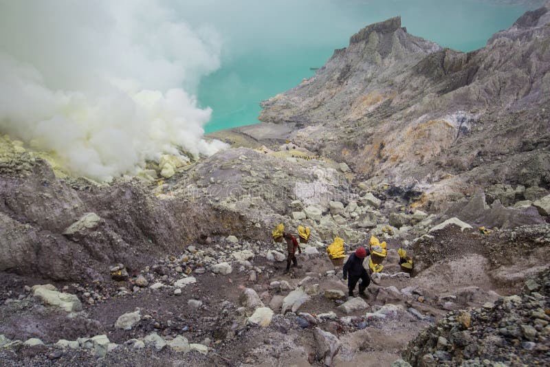 People mining sulphur in Ijen volcano, Java , Indonesia royalty free stock photography