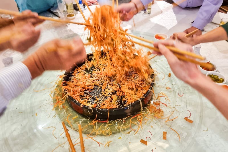chinese new year tossing noodles