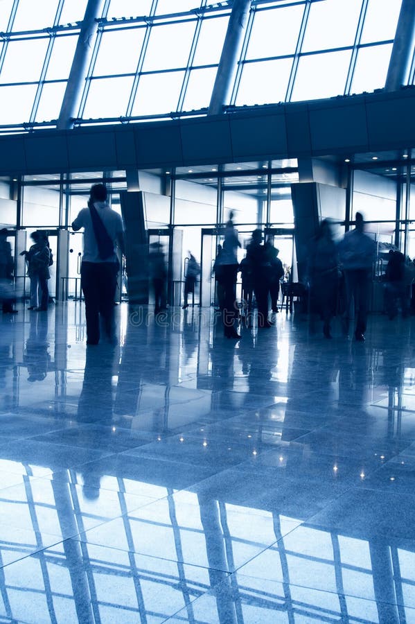 People in a modern architectural interior royalty free stock image