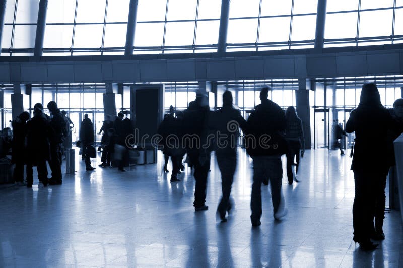 People in a modern architectural interior stock images