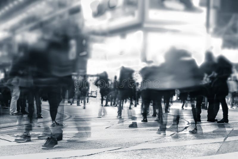 Blurred image of people moving in crowded night city street. Art toning abstract urban background. Hong Kong. Blurred image of people moving in crowded night city street. Art toning abstract urban background. Hong Kong