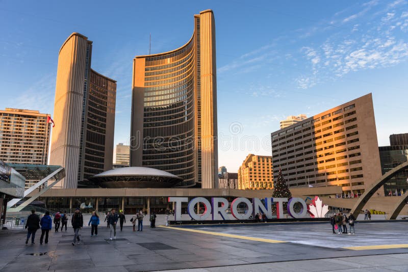 People in Nathan Phillips Square, Toronto, On, Canada, at Sunset