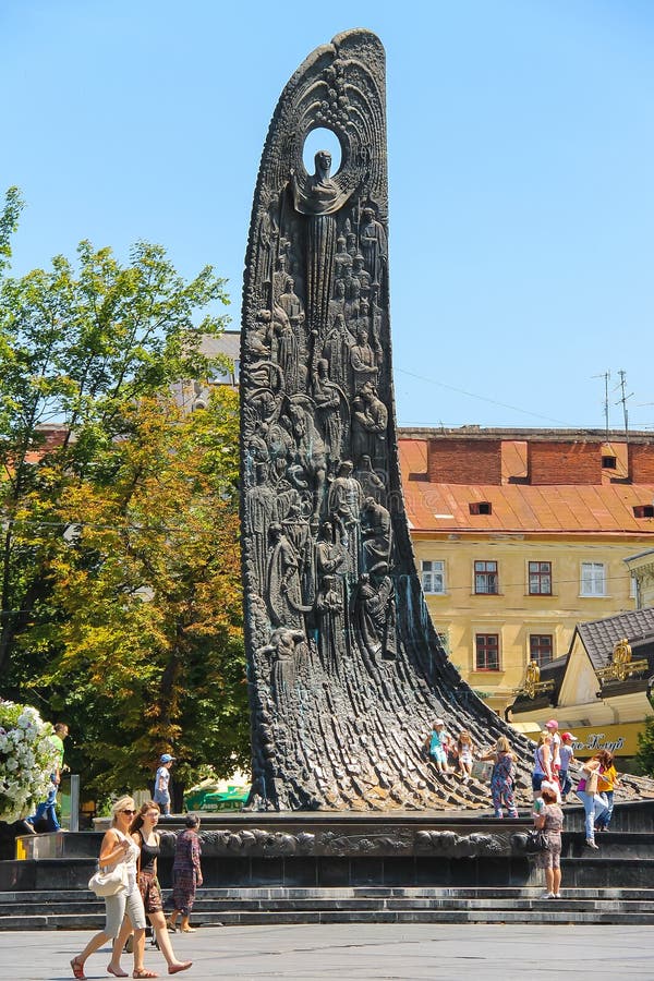 People near Shevchenko Monument in historic city center. Lviv royalty free stock photo People near Shevchenko Monument in historic city center. Lviv royalty free stock photo