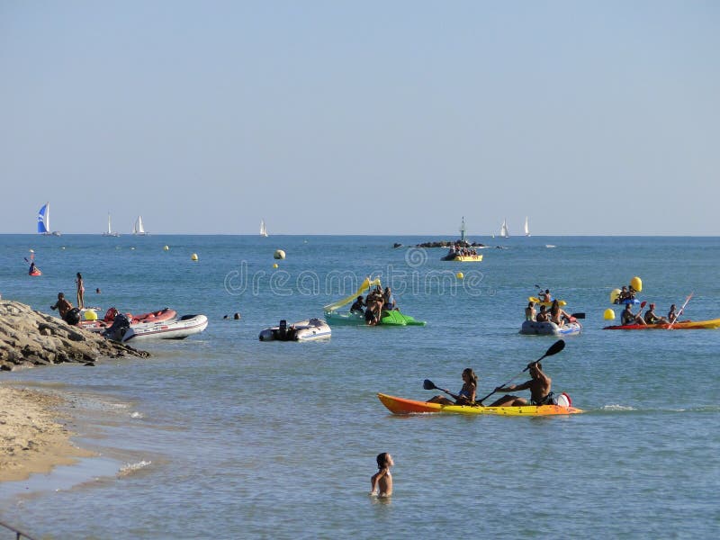 People playing and doing sports in the sea water