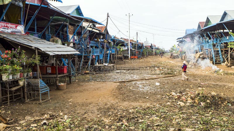 People in Poor Floating village Chong Knies in Cambodia, Tonle Sap Great lake. Dogs royalty free stock photo People in Poor Floating village Chong Knies in Cambodia, Tonle Sap Great lake. Dogs royalty free stock photo