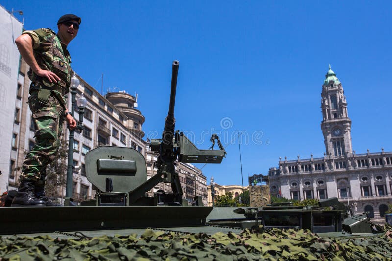 People during a public demonstration of the military equipment in the central square of the city.