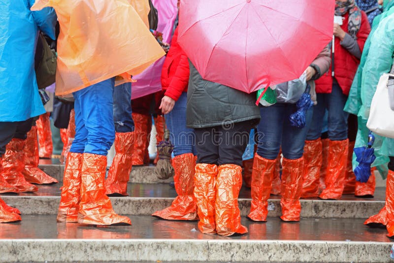 People with rain coat and gaiters during flood royalty free stock photo