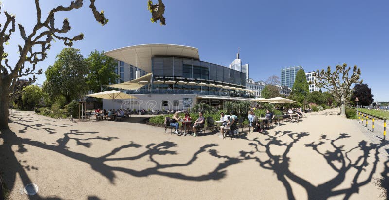 People Relax At The Bank Of River Main In Nizza Gardens Editorial