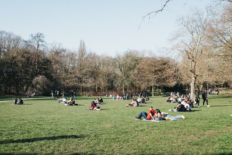 People relaxing in Holland Park, London, UK,on the hottest spring day