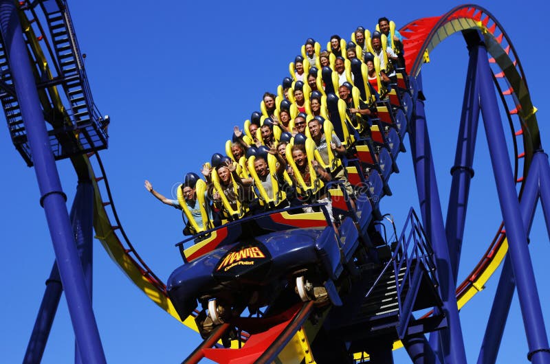 People riding roller coaster royalty free stock photography