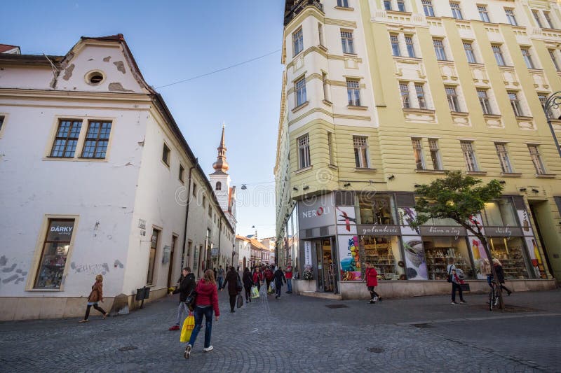 People rushing and walking in a pedestrian street of Brno, Orli Ulice, surrounded by shops and boutiques in the city center. BRNO, CZECHIA - NOVEMBER 5, 2019 royalty free stock image People rushing and walking in a pedestrian street of Brno, Orli Ulice, surrounded by shops and boutiques in the city center. BRNO, CZECHIA - NOVEMBER 5, 2019 royalty free stock image