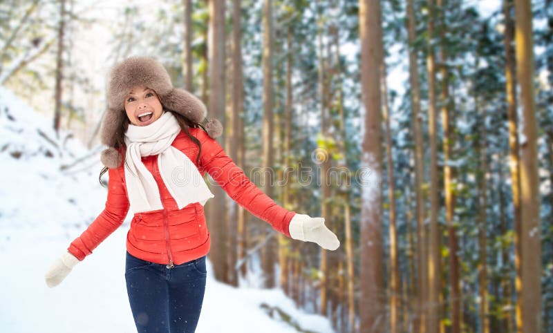 Happy woman in fur hat over winter forest royalty free stock images Happy woman in fur hat over winter forest royalty free stock images