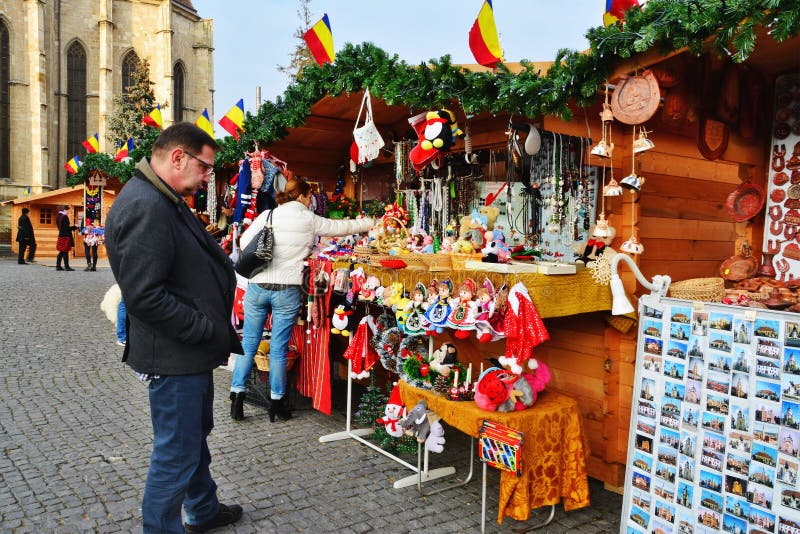 People shop gifts for Christmas at market stalls