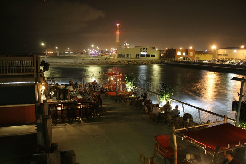 People sitting on bar terrace