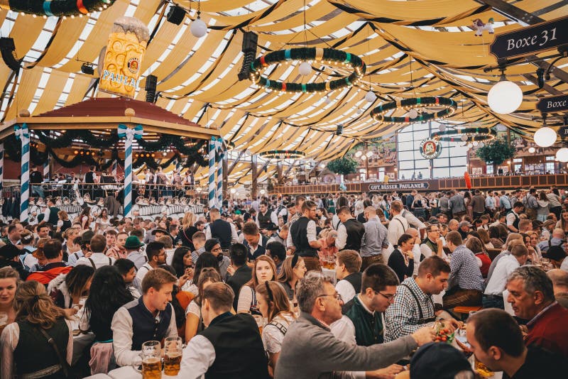 People sitting in beer tent at Oktoberfest Munich.