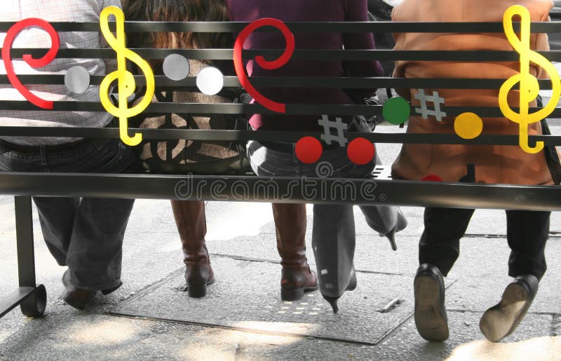 People sitting on a bench royalty free stock photography
