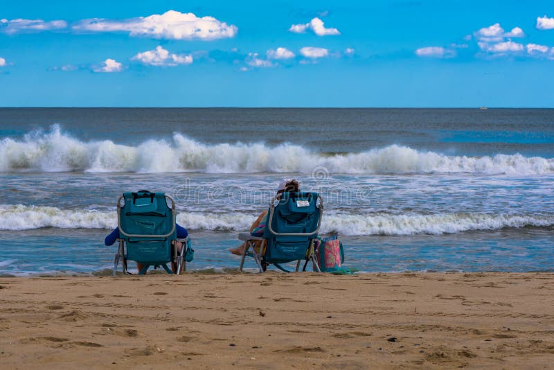 1,089 People Sitting Beach Chairs Photos - Free &amp; Royalty-Free Stock Photos  from Dreamstime