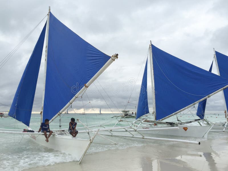 People sitting on the sailing boats in Boracay, Philippines. Philippines atm machine stock images, royalty-free photos and pictures