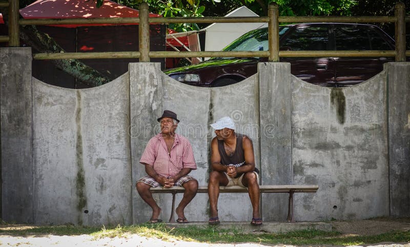 People sitting on street in Port Louis, Mauritius