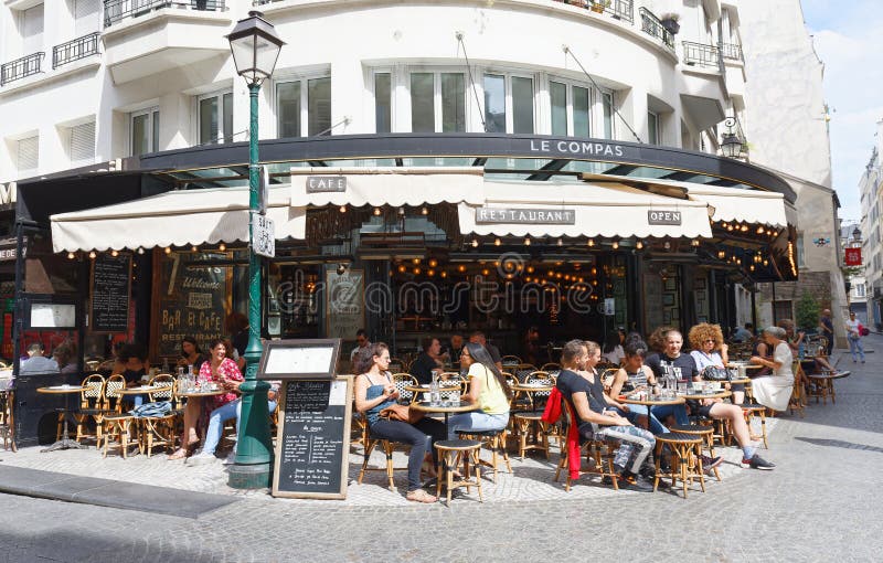 People Sitting in a Traditional French Cafe Compas on Rue Montorgueil ...