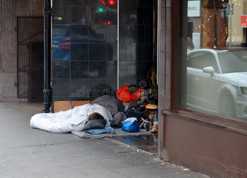 People sleeping in a doorway