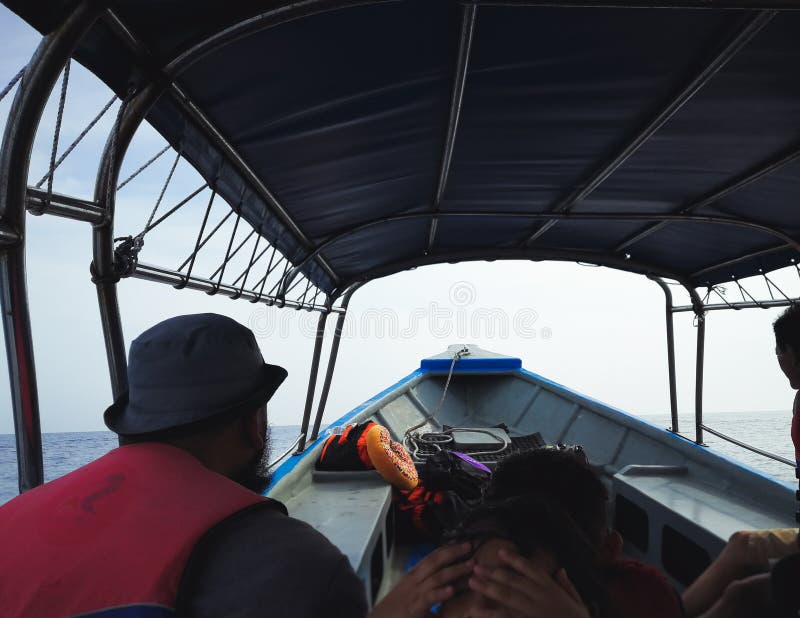 People in a speedboat trip to a tropical island. royalty free stock images People in a speedboat trip to a tropical island. royalty free stock images