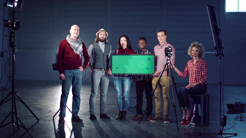 People standing with chromakey board