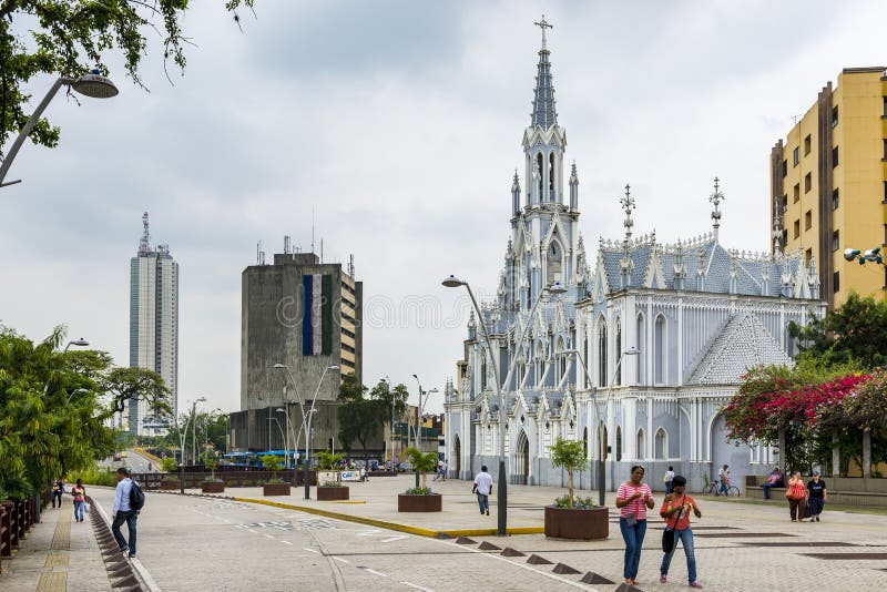 People in a street in front of the La Ermita Church in city of Cali, Colombia