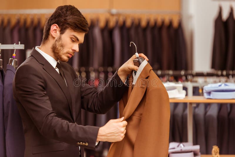 People in suit shop stock photo. Image of male, brown - 66068762