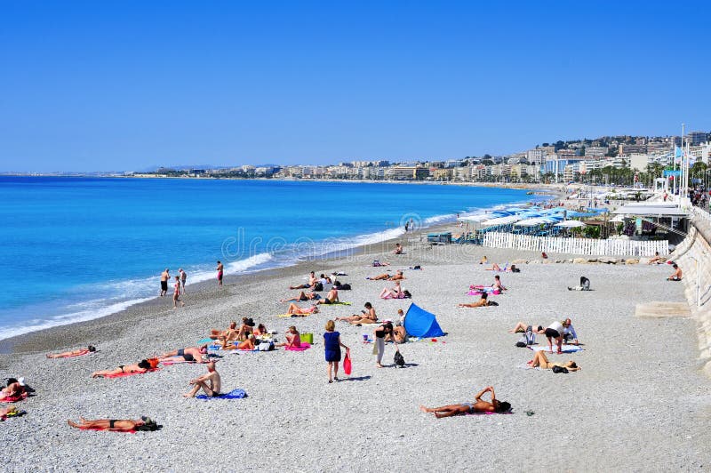 People Sunbathing On The Beach In Nice, France Editorial 