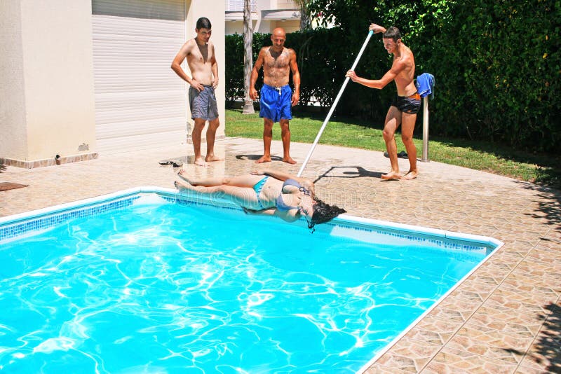 Man throwing woman to swimming pool. Man throwing woman to swimming pool.