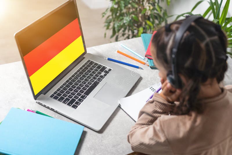 People Using Laptop and Showing on the Screen the Flag of GERMANY