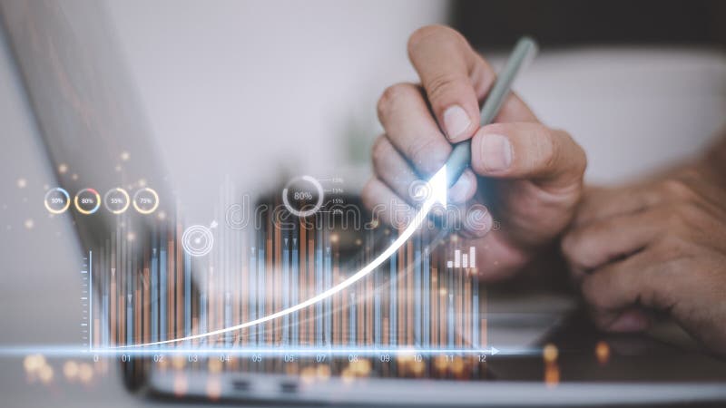 People using tablets And using his finger to touch the screen With a business graph showing up in a virtual screen. New startup stock photo