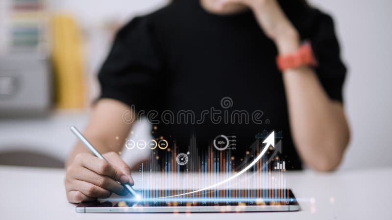 People using tablets And using his finger to touch the screen With a business graph showing up in a virtual screen. New startup royalty free stock photo