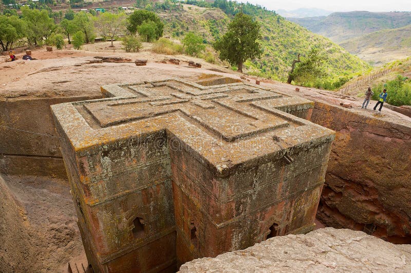 People visit unique monolithic rock-hewn Church of St. George Bete Giyorgis, UNESCO World heritage, in Lalibela, Ethiopia. royalty free stock photography People visit unique monolithic rock-hewn Church of St. George Bete Giyorgis, UNESCO World heritage, in Lalibela, Ethiopia. royalty free stock photography