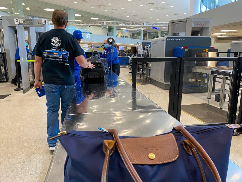 People waiting in line at TSA security at St. Louis, MO Lambert International Airport STL