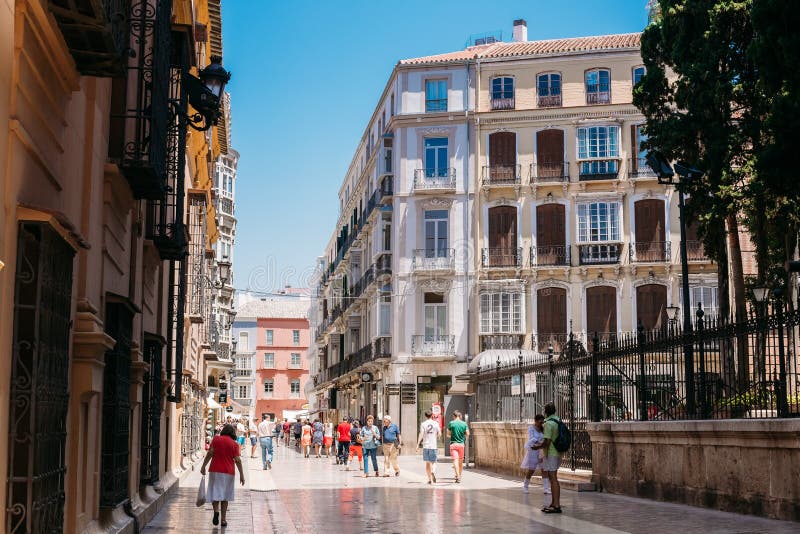 People Walk through the Streets of Malaga in Spain Editorial
