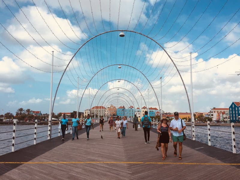 People walkin over the floating bridge Queen Emma bridge in W royalty free stock photos People walkin over the floating bridge Queen Emma bridge in W royalty free stock photos