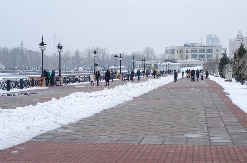 A people walking along the waterfront in winter stock photography A people walking along the waterfront in winter stock photography