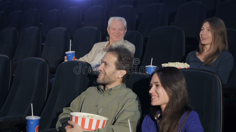 People watch comedy at the movie theater