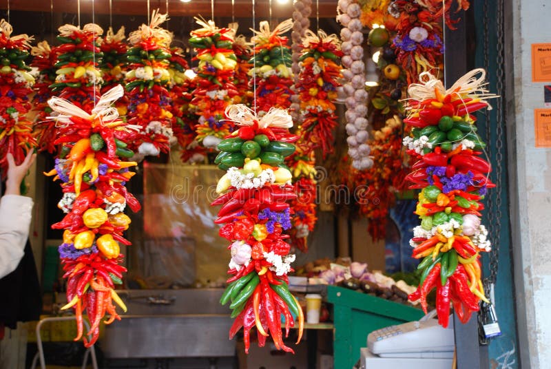 Beautiful fresh hanging chilies at Seattle city fish market. The chili pepper, chilli pepper, or chili, is the fruit of the plants from the genus Capsicum. Even though chilis may be thought of as a vegetable, their culinary usage is generally as a spice, the part of the plant that is usually harvested is the fruit. The name, which is spelled chili, chile, or chilli, comes from Nahuatl chÄ«lli via the Spanish word chile. The term chili in most of the world refers exclusively to the smaller, hot types of Capsicum. Chili peppers and their various cultivates originate in the Americas; they are now grown around the world because they are widely used as spices or vegetables in cuisine, and as medicine.Chili peppers have been a part of the human diet in the Americas since at least 7500 BC and perhaps earlier. There is archaeological evidence at sites located in southwestern Ecuador that chili peppers were already well domesticated more than 6000 years ago, and is one of the first cultivated crops in the Americas that is self-pollinating.Chili peppers are thought to have been domesticated at least five times by prehistoric peoples in different parts of South and North America, from Peru in the south to Mexico in the north and parts of Colorado and New Mexico (Ancient Pueblo Peoples).Christopher Columbus was one of the first Europeans to encounter them, and called them peppers because of their similarity in taste (not in appearance) with the Old World peppers of the Piper genus. Beautiful fresh hanging chilies at Seattle city fish market. The chili pepper, chilli pepper, or chili, is the fruit of the plants from the genus Capsicum. Even though chilis may be thought of as a vegetable, their culinary usage is generally as a spice, the part of the plant that is usually harvested is the fruit. The name, which is spelled chili, chile, or chilli, comes from Nahuatl chÄ«lli via the Spanish word chile. The term chili in most of the world refers exclusively to the smaller, hot types of Capsicum. Chili peppers and their various cultivates originate in the Americas; they are now grown around the world because they are widely used as spices or vegetables in cuisine, and as medicine.Chili peppers have been a part of the human diet in the Americas since at least 7500 BC and perhaps earlier. There is archaeological evidence at sites located in southwestern Ecuador that chili peppers were already well domesticated more than 6000 years ago, and is one of the first cultivated crops in the Americas that is self-pollinating.Chili peppers are thought to have been domesticated at least five times by prehistoric peoples in different parts of South and North America, from Peru in the south to Mexico in the north and parts of Colorado and New Mexico (Ancient Pueblo Peoples).Christopher Columbus was one of the first Europeans to encounter them, and called them peppers because of their similarity in taste (not in appearance) with the Old World peppers of the Piper genus.