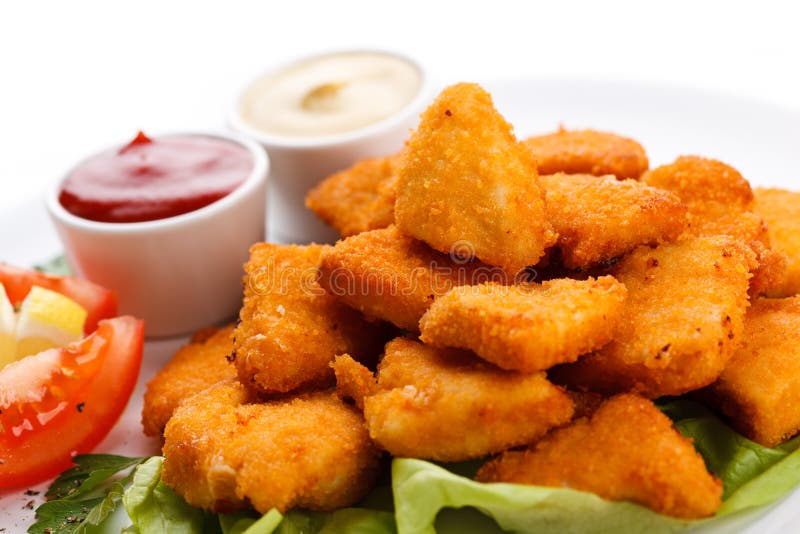 Pepite di pollo fritto fotografia stock libera da diritti Pepite di pollo fritto fotografia stock libera da diritti