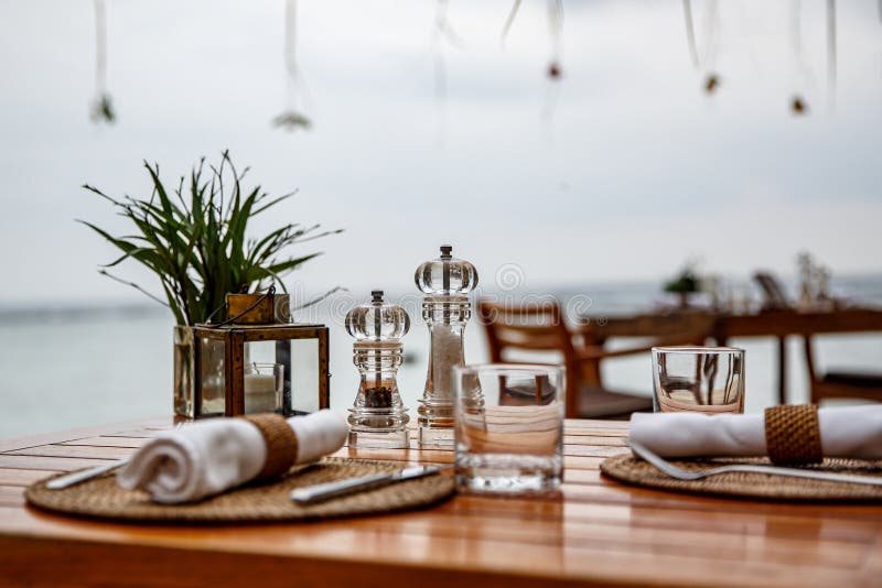 Pepper and Salt Shaker on the Table of a Coastal Cafe Stock Image