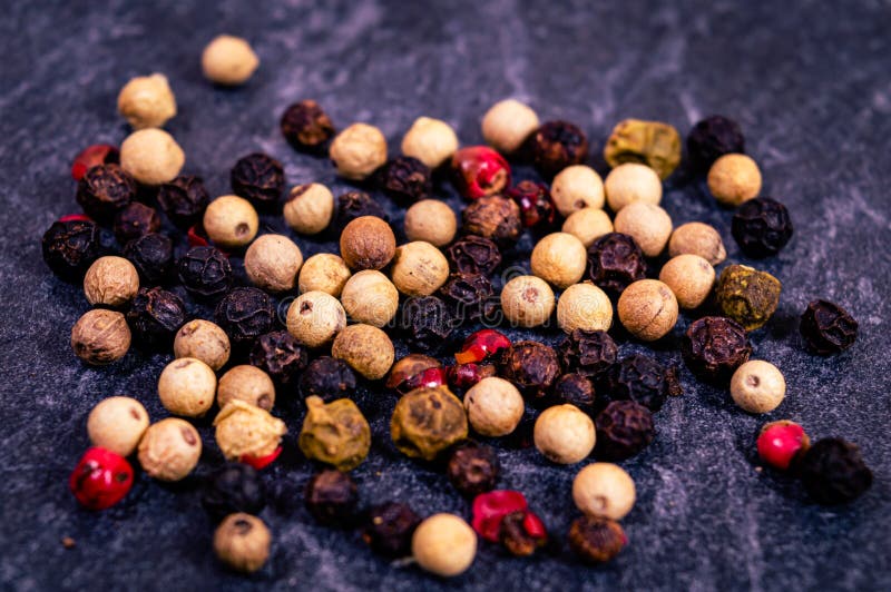 Closeup of a White, Black, Red and Yellow Peppercorn Blend Stock Image