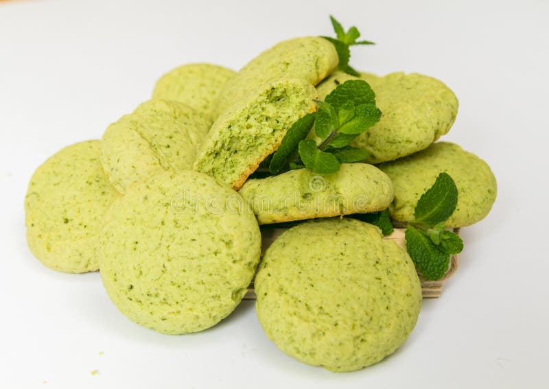 Peppermint Cookies with fresh mint leaves, the closeup on white background. Peppermint Cookies with fresh mint leaves, the closeup, isolated on white background royalty free stock image