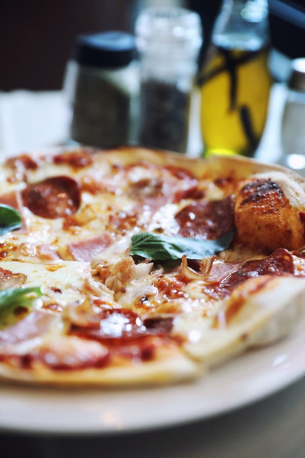 Pepperoni Bacon and Ham Pizza in Restaurant Stock Photo Image of