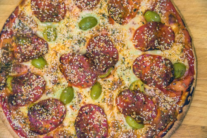 Pepperoni pizza beautiful arrangement. Hot Homemade Pepperoni Pi royalty free stock photo Pepperoni pizza beautiful arrangement. Hot Homemade Pepperoni Pi royalty free stock photo